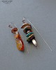 kolczyki wire wrapping Autorskie designerskie zakręcone niezwykłe kolczyki handmade bursztyn