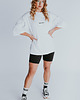 t-shirt damskie Biała koszulka oversized z napisem CLASSY AS FUCK