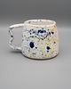 kubki Ceramiczny kubek z falistym uszkiem