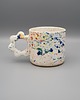 kubki Ceramiczny kubek z kwiatowym uszkiem