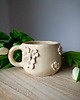 kubki Ceramiczny kubek z motywem kwiatów