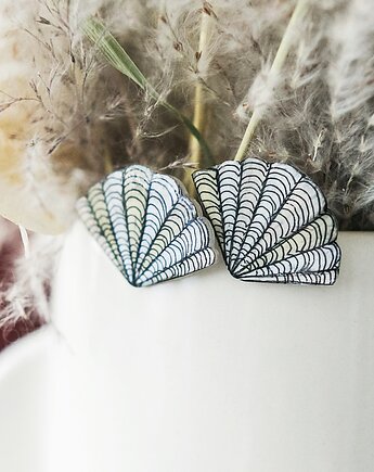 Klipsy muszelki, Pintura