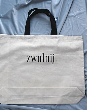 Bardzo duża bawełniana beżowa torba z afirmacją ZWOLNIJ, mniej więcej