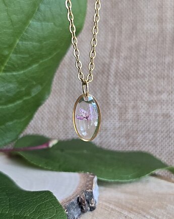 Złota jajowata zawieszka z kwiatami, zkwiatem