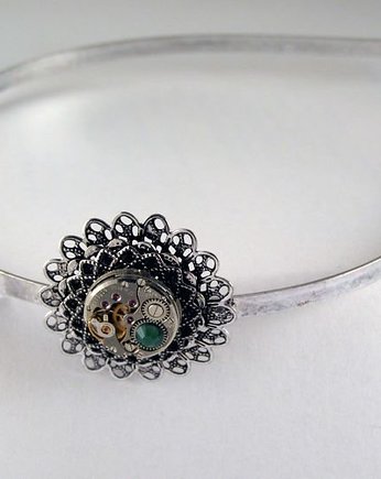 Mechaniczna opaska 133, Zegarynki