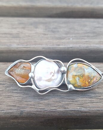 Fala - broszka, po drugiej stronie lustra