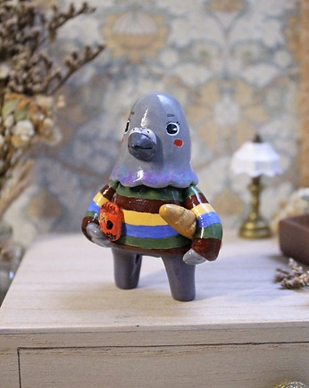 Gołąb na zakupach, Qletta Clay