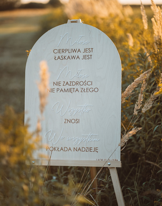 dodatki ślubne Tablica powitalna Hymn do miłości 50x70 cm - naturalna