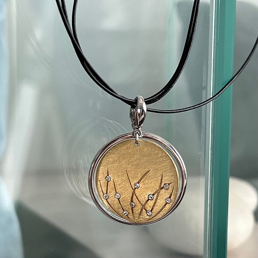 złote naszyjniki Naszyjnik srebrny pozłacany koła z cyrkoniami na czarnym rzemieniu