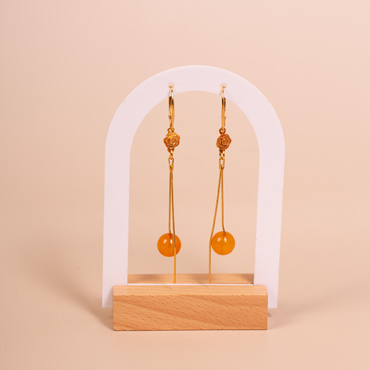 kolczyki srebrne Kolczyki srebrne pozłacane wiszące z bursztynową kulką