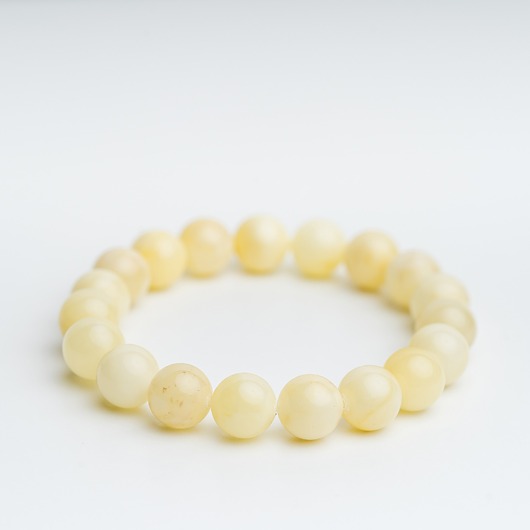 bransoletki z kamieni naturalnych Bransoletka bursztyn mleczny biały regularna kulka