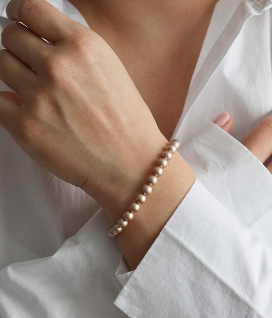 bransoletki z kamieni naturalnych Bransoletka z beżowych pereł Swarovskiego