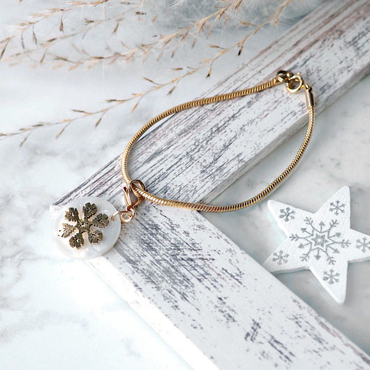 bransoletki złote POZŁACANA BRANSOLETKA Z ZAWIESZKĄ golden snowflake on pearl