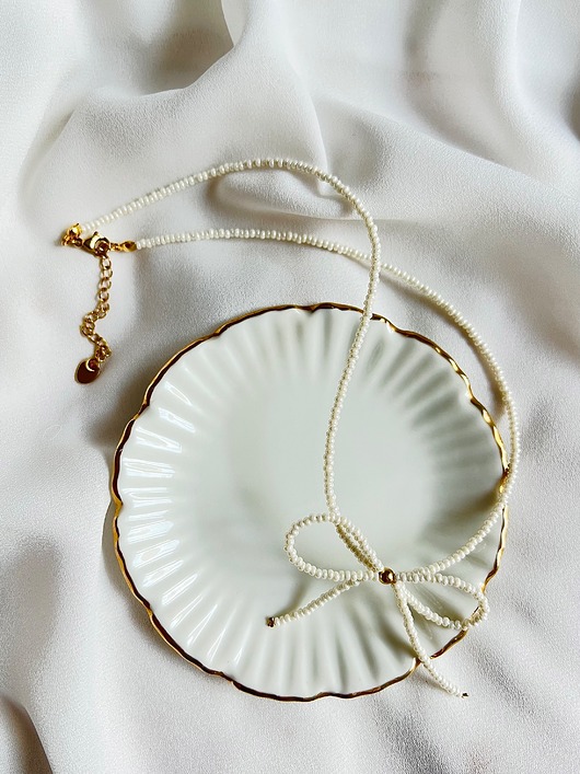 chokery Naszyjnik z kokardką perłowy