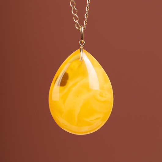wisiory Złoty wisiorek z miodowym bursztynem bałtyckim