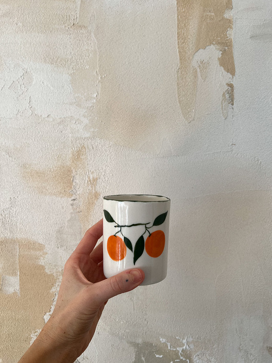 kubki Kubek porcelanowy z pomarańczami z zielonym rantem