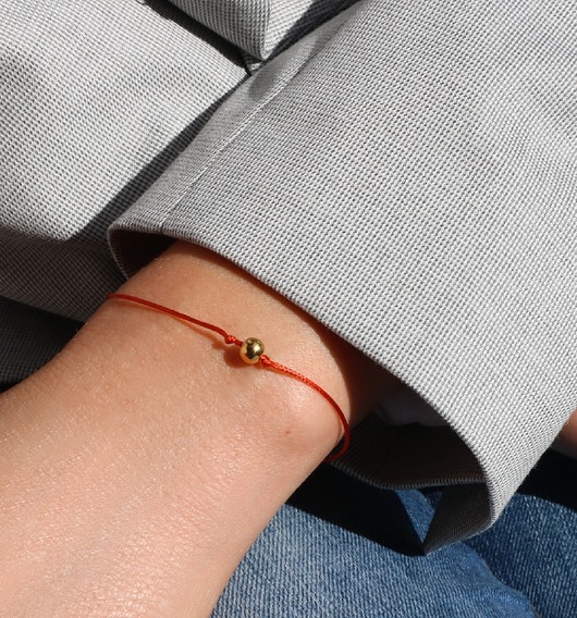 Bransoletka sznurkowa na szczęście  z kulką Coccola JEWELLERY