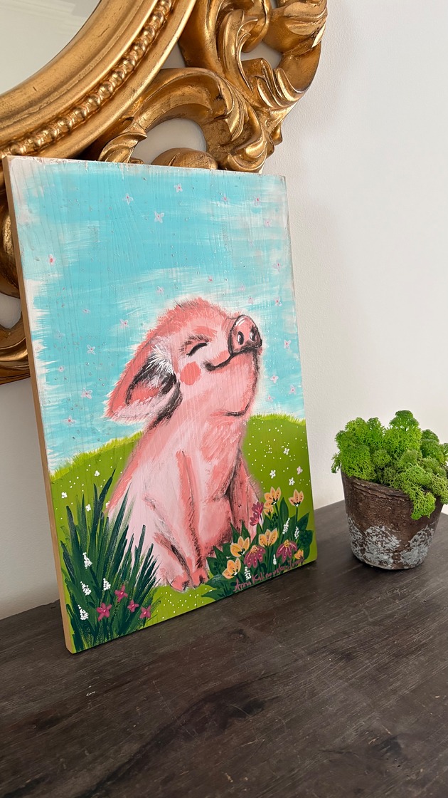 obrazy Szczęśliwa świnka - chwila beztroski na łące obraz na drewnie