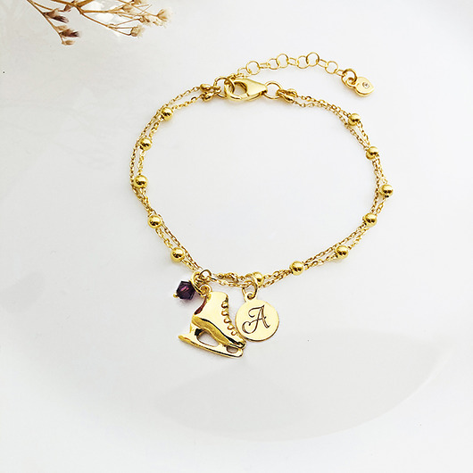 bransoletki złote Bransoletka z łyżwą , złota łyżwa literka do wyboru