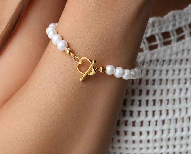 bransoletki złote Bransoletka z pereł naturalnych z ozdobnym zapięciem- srebro 925 pozłacane